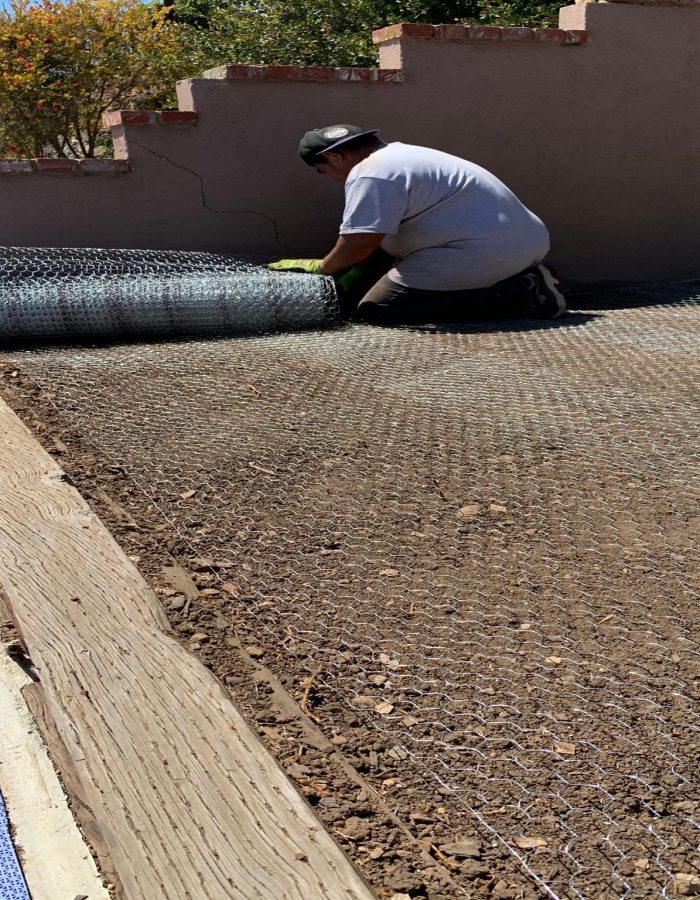 Gopher prevention by Installation of mesh netting to stop gophers prior to sod installation