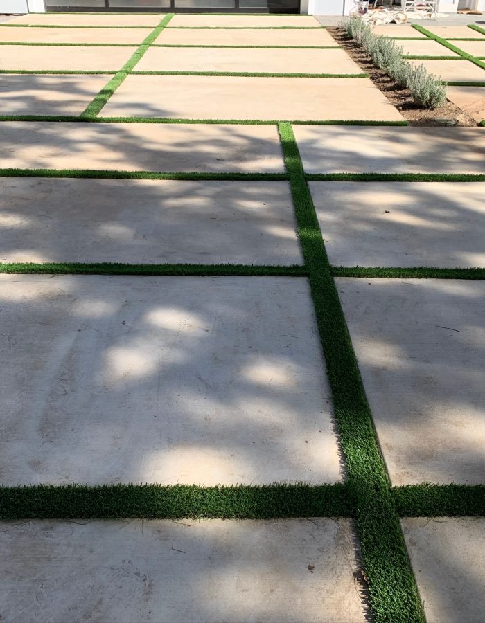 Installation of Artificial turf between slabs